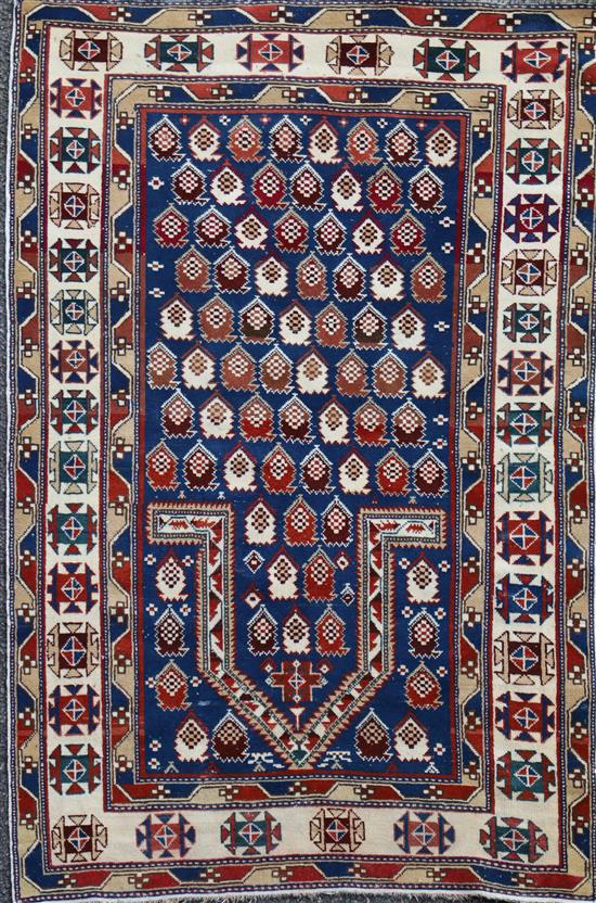 A Caucasian blue ground prayer rug, 4ft 10in by 3ft 5in.